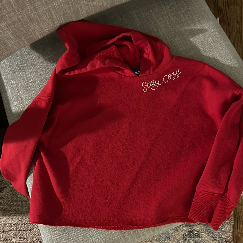 Red “stay cozy” hooded sweatshirt